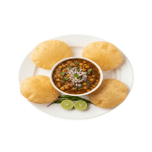 Plate of crispy puri served with spicy chole garnished with onions, coriander, green chilies and lemon slices